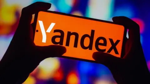 Getty Images Yandex logo on smartphone.