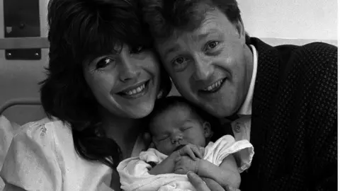 PA Maggie Philbin and Keith Chegwin with baby daughter