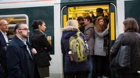 Getty Images Commuters jammed onto a train