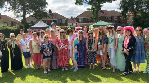 Group photograph of staff at St Paul and St Timothy's Catholic Infants School