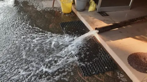 Joshy Maliyekkal Brown liquor gushing out of a hose
