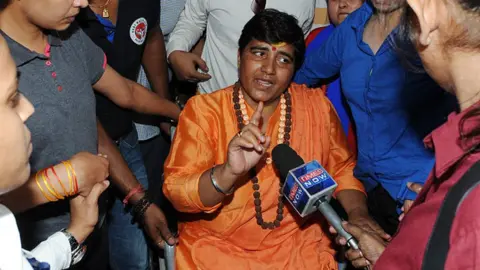Getty Images Hindu activist Sadhvi Pragya Singh Thakur leaving for Simhastha in Ujjain under heavy police protection on May 18, 2016 in Bhopal, India.