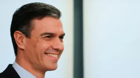 Reuters Spain's acting Prime Minister Pedro Sanchez smiles during a presentation of a coalition agreement with Podemos