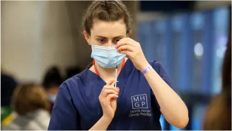 Getty Images Preparing a vaccine