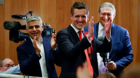 Reuters London Mayor Sadiq Khan celebrates with the new leader of Wandsworth Council Simon Hogg