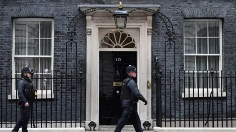 Getty Images Police walking outside Downing Street