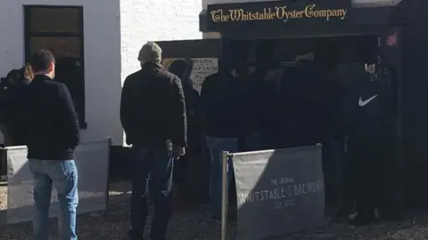 Sara Tilley People queue at Whitstable Oyster Company