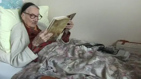 bbc Elderly woman reading