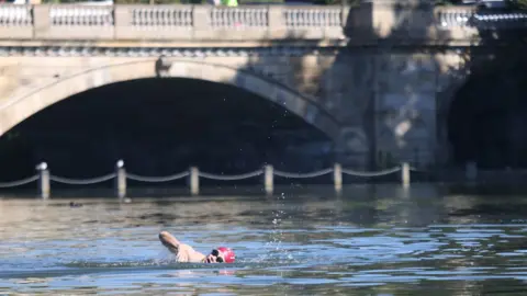 PA Media Early morning swimmer, London, 11 July