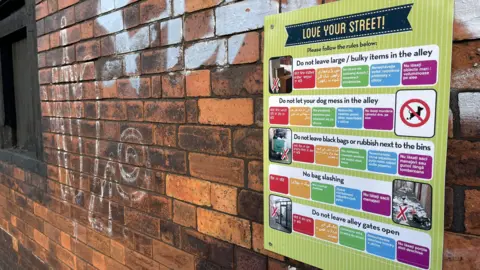 Matt Weigold / BBC A poster titled 'love your street'