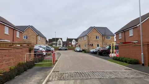 A general view of Leveret Gardens in Stowmarket. Cars can be seen parked outside homes.