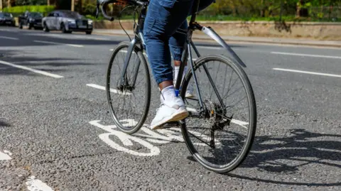 Getty Images A person cycling in a cycle lane.