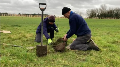Swindon Borough Council Volunteers planting trees at Stanton Park