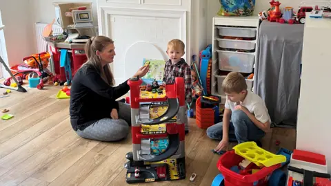 BBC Harlie Swann with her two boys Finnlie and Frankie who live in temporary housing in south London