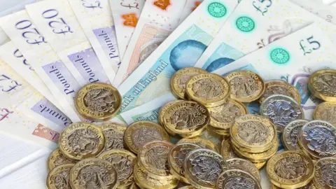 One pound coins and £5, £10, £20 & £50 notes.