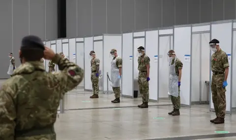 Peter Byrne / PA WIre Soldiers at the Arena Convention Centre in Liverpool.