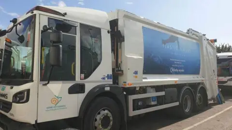 Image of a waste vehicle truck with Derby City Council branding on the passenger door