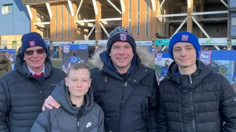 Bryant family Joe Bryant with his family outside Portman Road stadium.