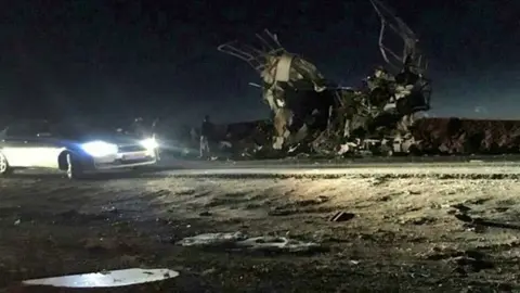 AFP Photo released by Iran's Fars news agency purportedly showing remains of bus targeted in suicide bomb attack in south-eastern Iran on 13 February 2019