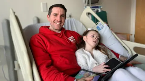 Amelia Carroll with her father Mike