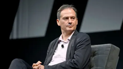Getty Images Christo Grozev speaking at an event in New York in September 2022