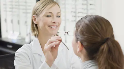 Getty Images Optician tests glasses