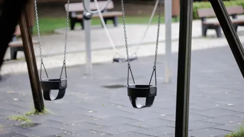 Getty Images Swings in an empty playground in Romania