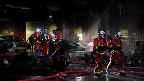 Reuters Firefighters put out the fire