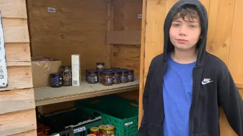 Friends of Isaac’s Food Bank Isaac at the food bank