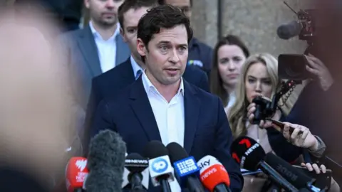 Getty Images Nick McKenzie speaks to media outside court