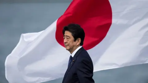 Getty Images Japanese Prime Minister Shinzo Abe at Joint Base Pearl Harbor Hickam's Kilo Pier on December 27, 2016 in Honolulu, Hawaii.