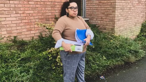 Lana Crosbie Lana Crosbie holding papers