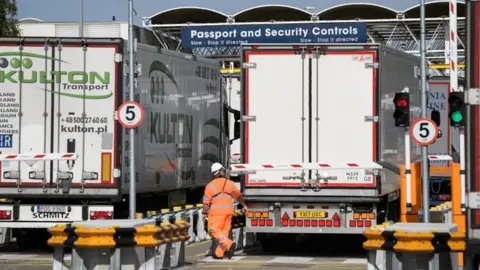 Getty Images Trucks being checked at customs