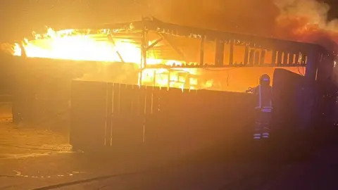 Maiden Newton Fire Station Fire fighter tackling blaze