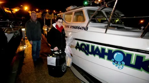 Steven McAuley/McAuley Multimedia  Northern Ireland's only off-shore ballot box arrives in Ballycastle harbour from Rathlin Island on a private charter