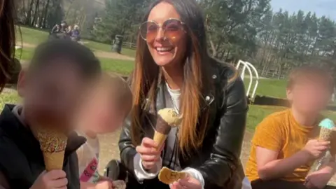 Handout Frankie Jules-Hough has brown long hair and wears sunglasses. She is smiling