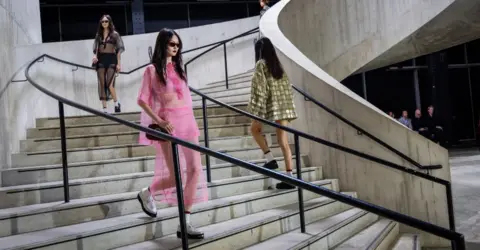 Getty Images Models walk the runway at the Gucci Cruise 2025 Fashion Show at Tate Modern on May 13, 2024 in London, England.