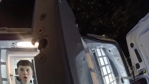 Marcus Staniforth can be seen sitting in the back of a police van. 