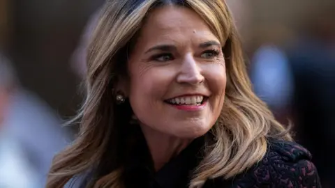 Savannah Guthrie looks off to the right.
