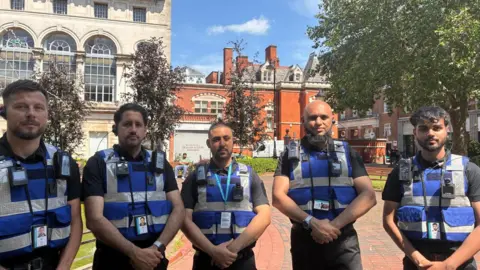 Five blue uniformed-council public spaces officers