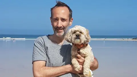 Family handout Justin Posner with his dog