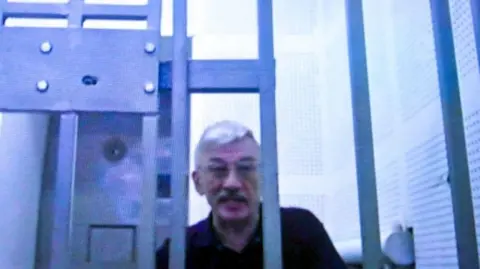 Oleg Orlov, speaking in Moscow court via video link