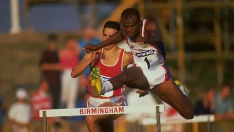 Getty Images KRISS AKABUSI OF GREAT BRITAIN CLEARS A HURDLE IN THE 400 METRES HURDLES AT THE MCVITIES CHALLENGE HELD TODAY AT THE ALEXANDER STADIUM IN BIRMINGHAM, ENGLAND.