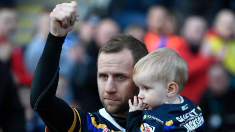 Rob Burrow with his son