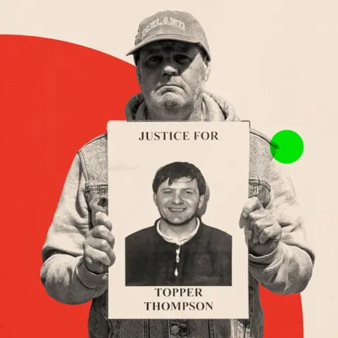 BBC Eugene Thompson holds up a poster featuring a photo of his brother 