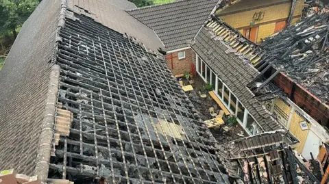 NIFRS Fire damaged church aerial photo showing missing roof