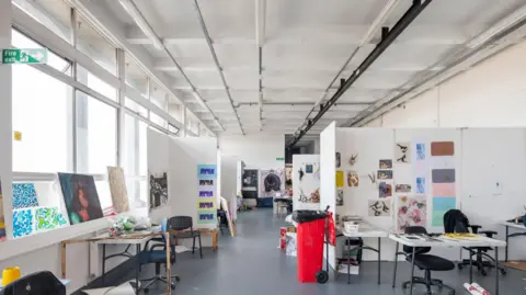 Historic England Archive An art classroom with number artworks on the window still and on white room dividers