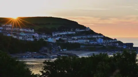 Bethan Kate Marsh The sun over New Quay in Ceredigion