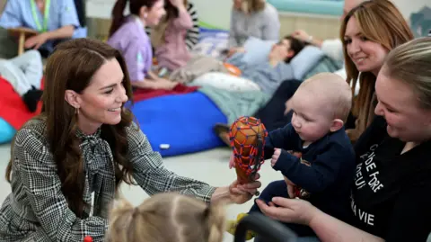 Reuters Princess of Wales playing with children at a children's hospice in Cardiff, Wales