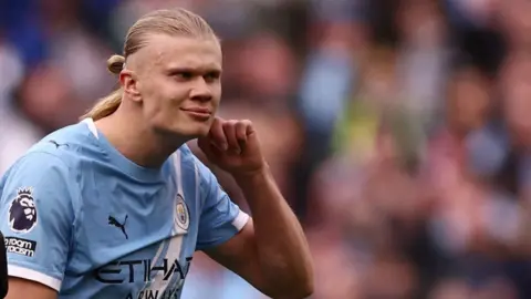 Erling Haaland celebrates at full-time